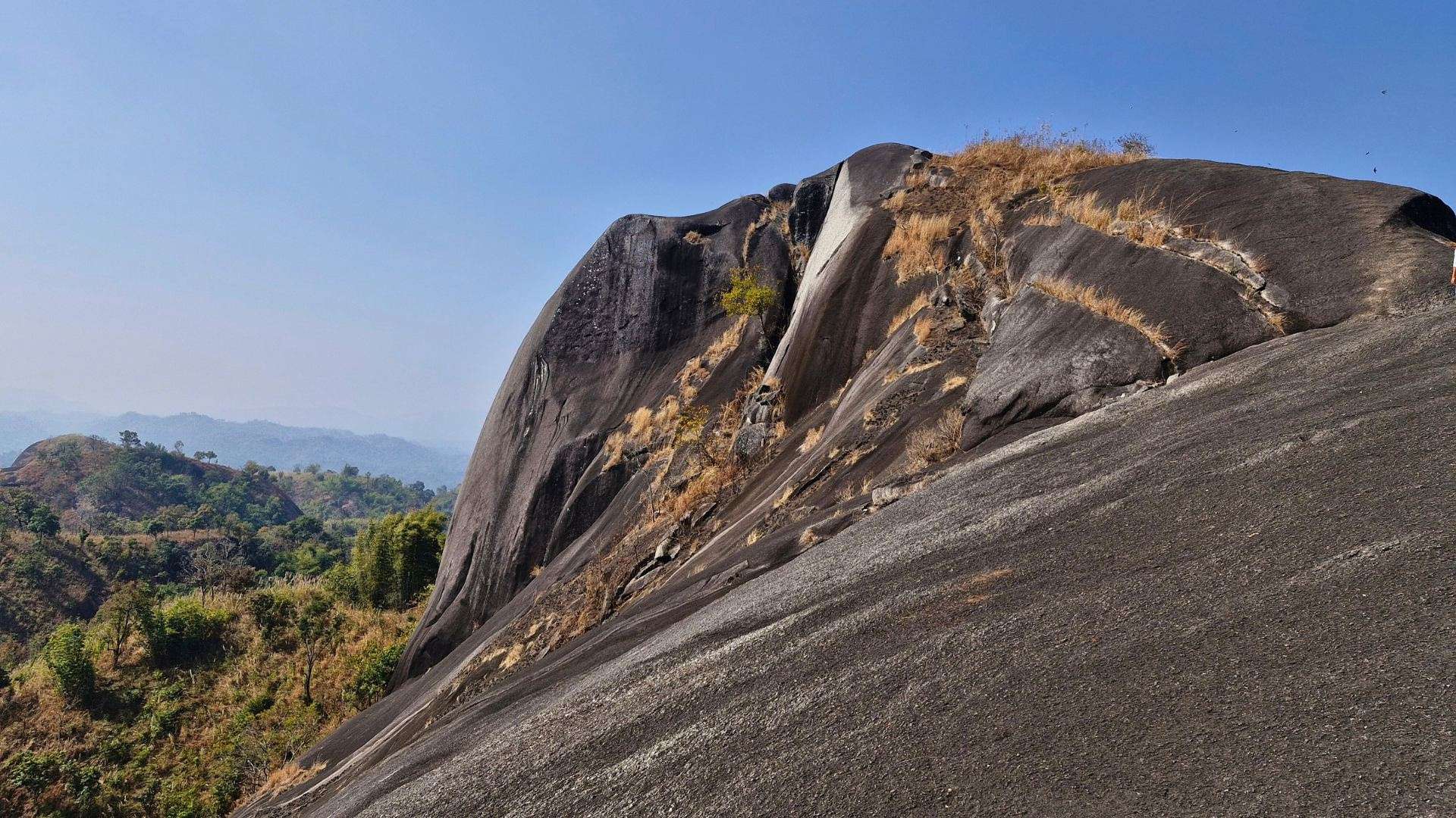 Balakhangor Peak overlooking Umswai Valley in Assam, surrounded by forests, hills and scenic landscapes